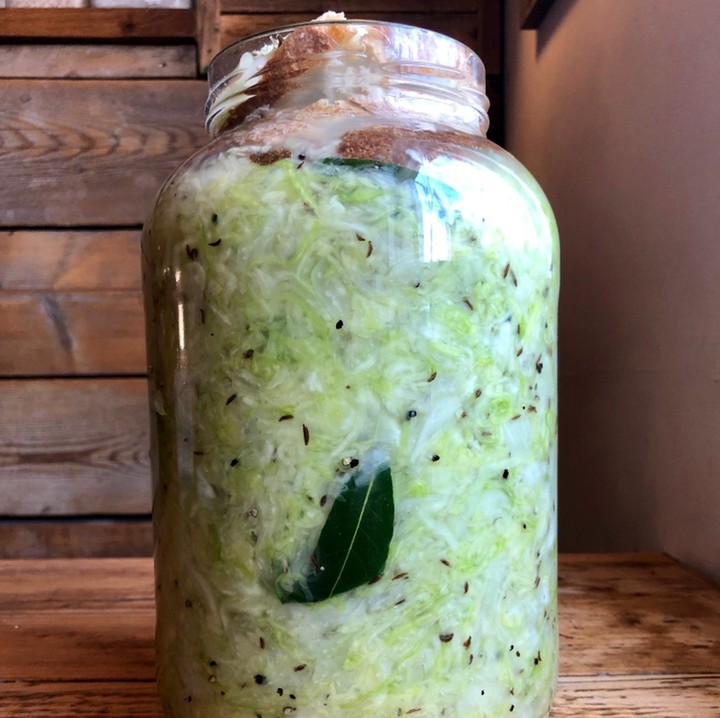 Homemade sauerkraut happily fermenting at Walcot Street. Massaged white cabbage, salt, bay leaves and caraway seeds. Simple pleasures that are so full of flavour. Ready in a week. #corkagebath #bath #spontaneousfermentation