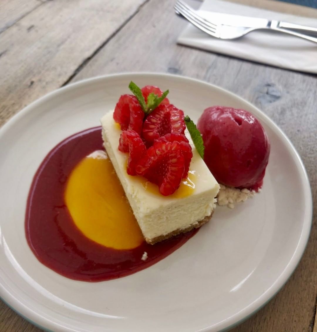 Baked vanilla cheesecake with raspberry and passion fruit coulis and raspberry sorbet. Set lunch and pre-theatre desert at Chapel Row this week. #corkagebath #setlunch #cheesecake #batheats