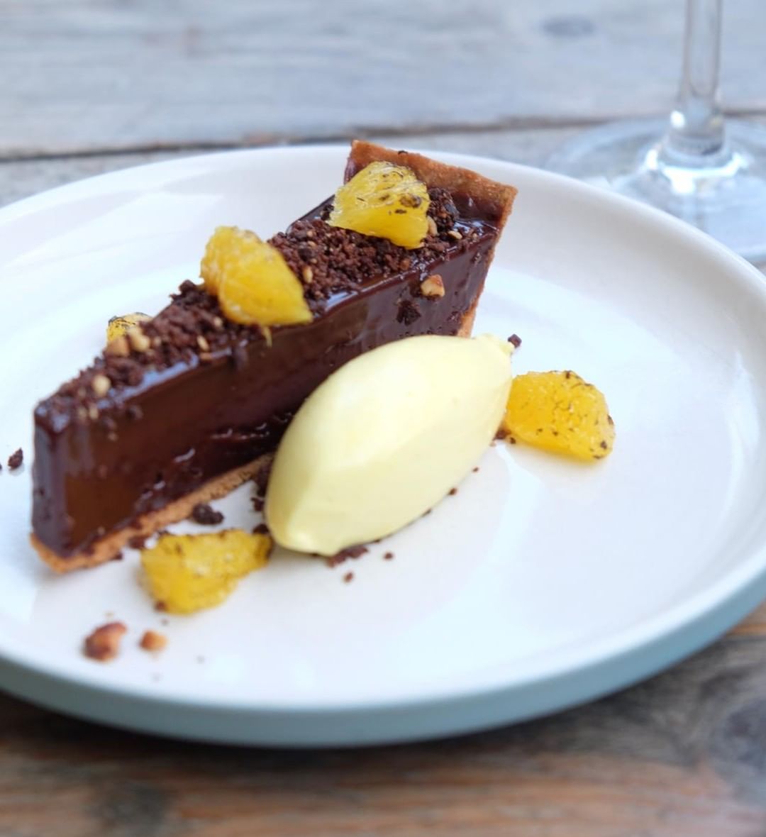 Chocolate ganache tart, chocolate crumb, orange cream. Set lunch menu dessert at Chapel Row this week. Lovely, warming colours.